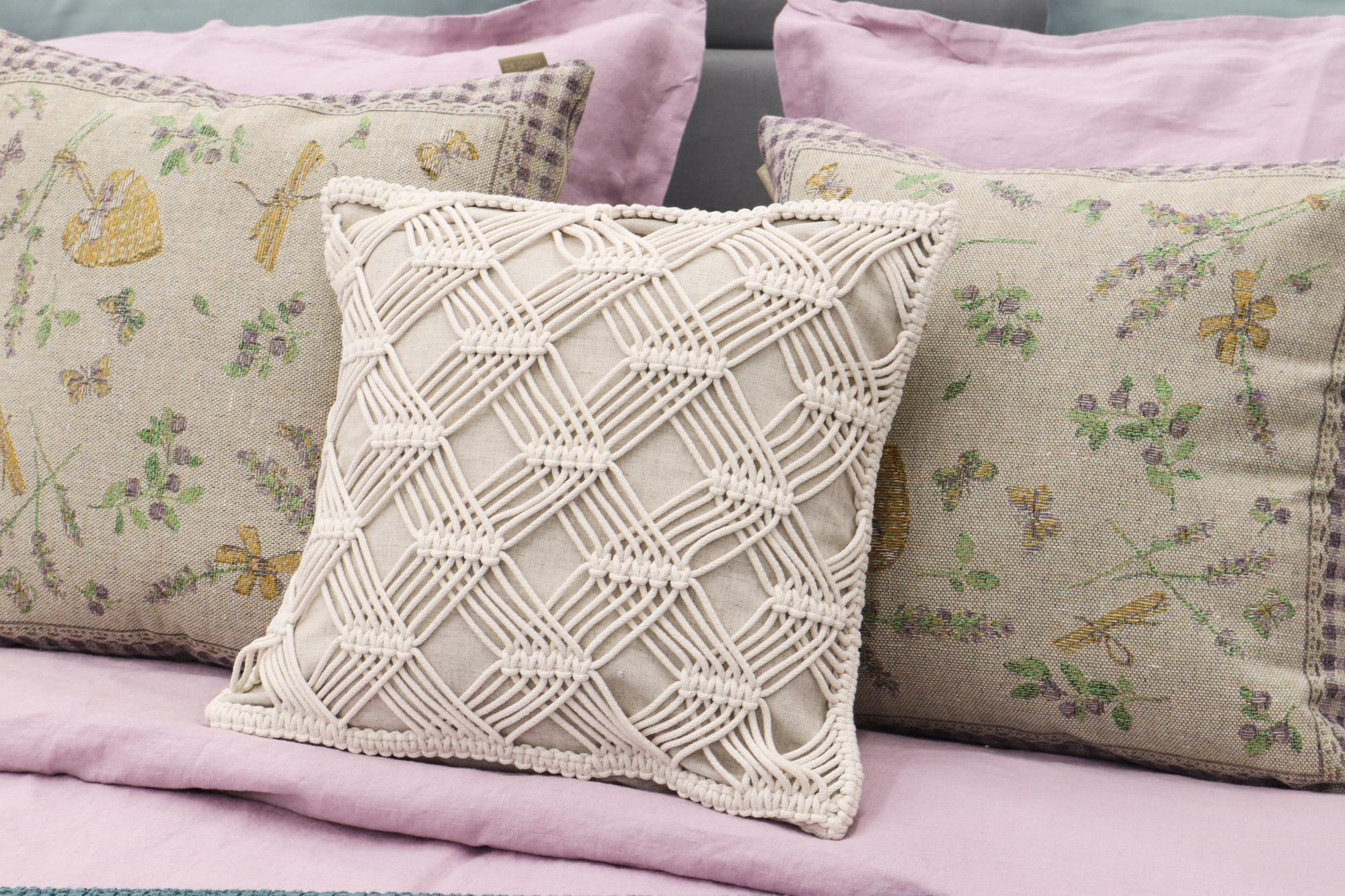embroidered linen cushion with geometric pattern